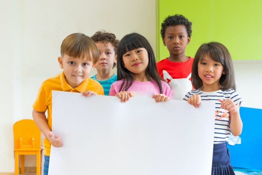 artificial intelligence - diversity children holding blank poster in classroom at kindergarten - Diversity Equity and Inclusion in STEM | Manifezt Foundation Diversity children holding blank poster in classroom at kindergarten