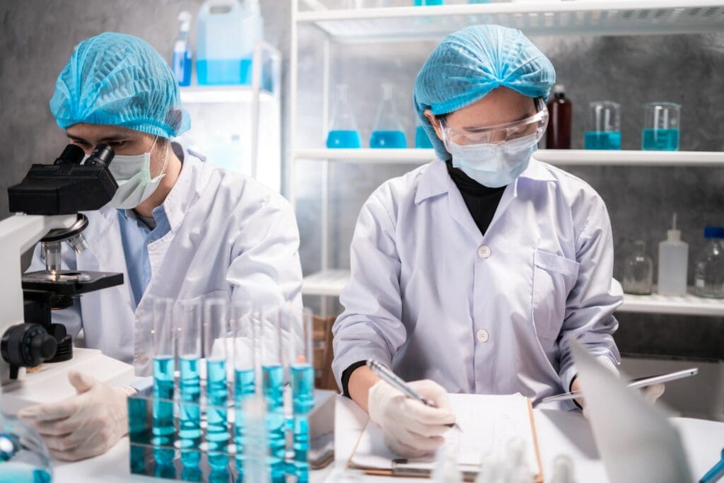 - svg+xml;charset=utf - Community Development Programs | Manifezt Foundation Health care researchers working in life science laboratory, medical science technology research