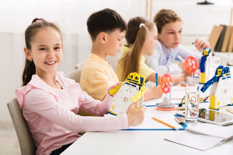 Stem education. Girl creating robot at lab STEM and Children